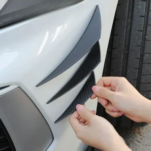 Carbon fiber style universal front bumper lip splitter with decorative fins, body spoiler canards, and valence chin design for car tuning and aerodynamic enhancement.