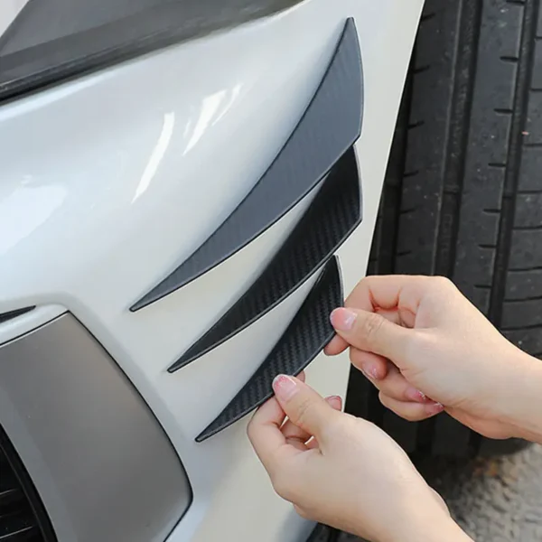 Carbon fiber style universal front bumper lip splitter with decorative fins, body spoiler canards, and valence chin design for car tuning and aerodynamic enhancement.